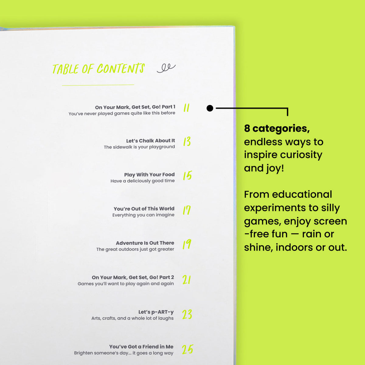 Family holding the open Kids Edition journal outdoors
