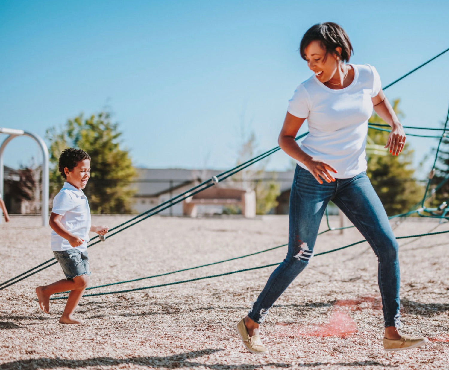 10 Things to Do Before School Starts (For Families). Mother and son playing in a outdoor obstacle course.