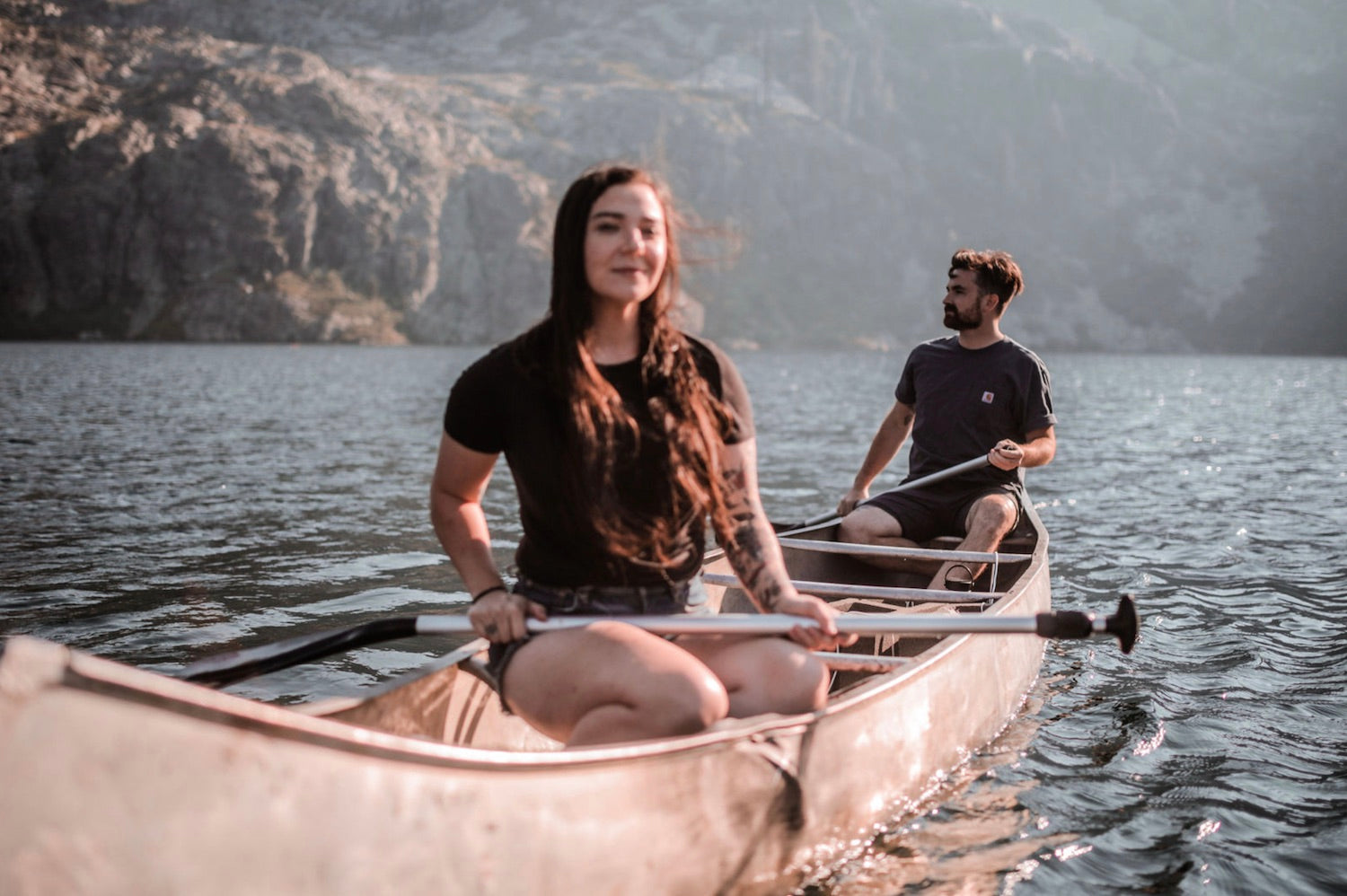 Couple on a rowboat in the middle of the lake