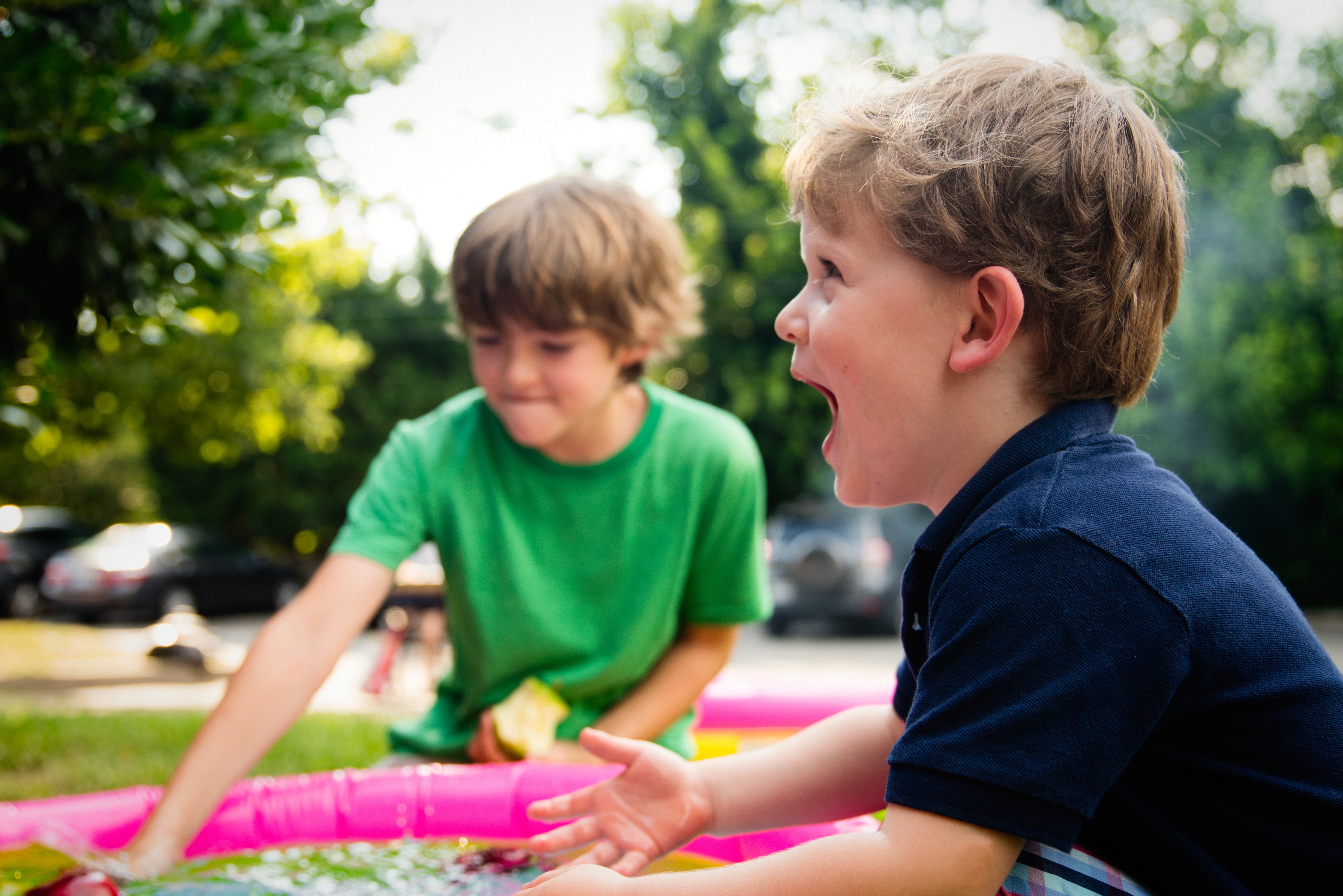 Why After School Activities Are so Important For Kids (And You!). Two boys playing with the inflatable pool in their backyard.