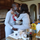 Happy couple kissing on the countertop after completing a challenge in The Adventure Challenge: Couples Edition book.