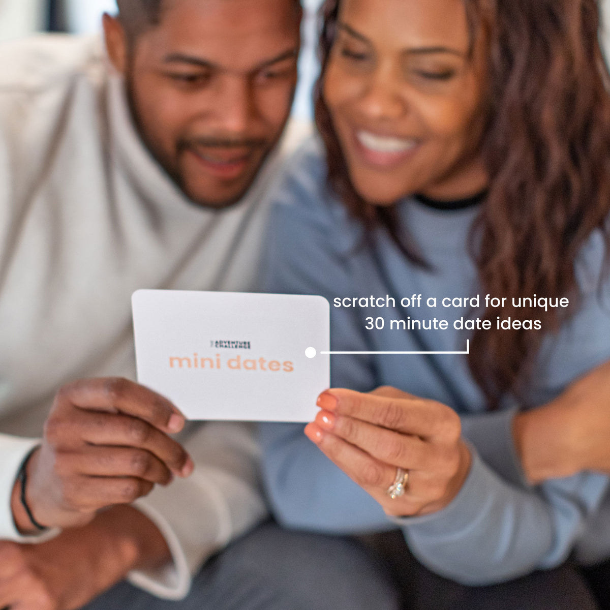 Couple scratching off a Mini Dates card for a 30-minute date idea